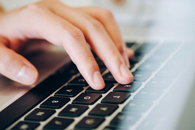 laptop typing. alert1 medical alert systems